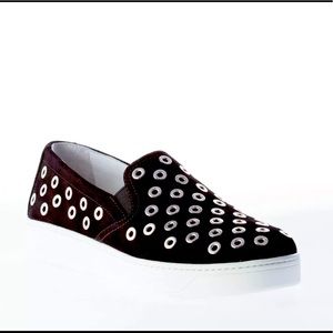 PRADA Black slip on with silver metal grommets.
